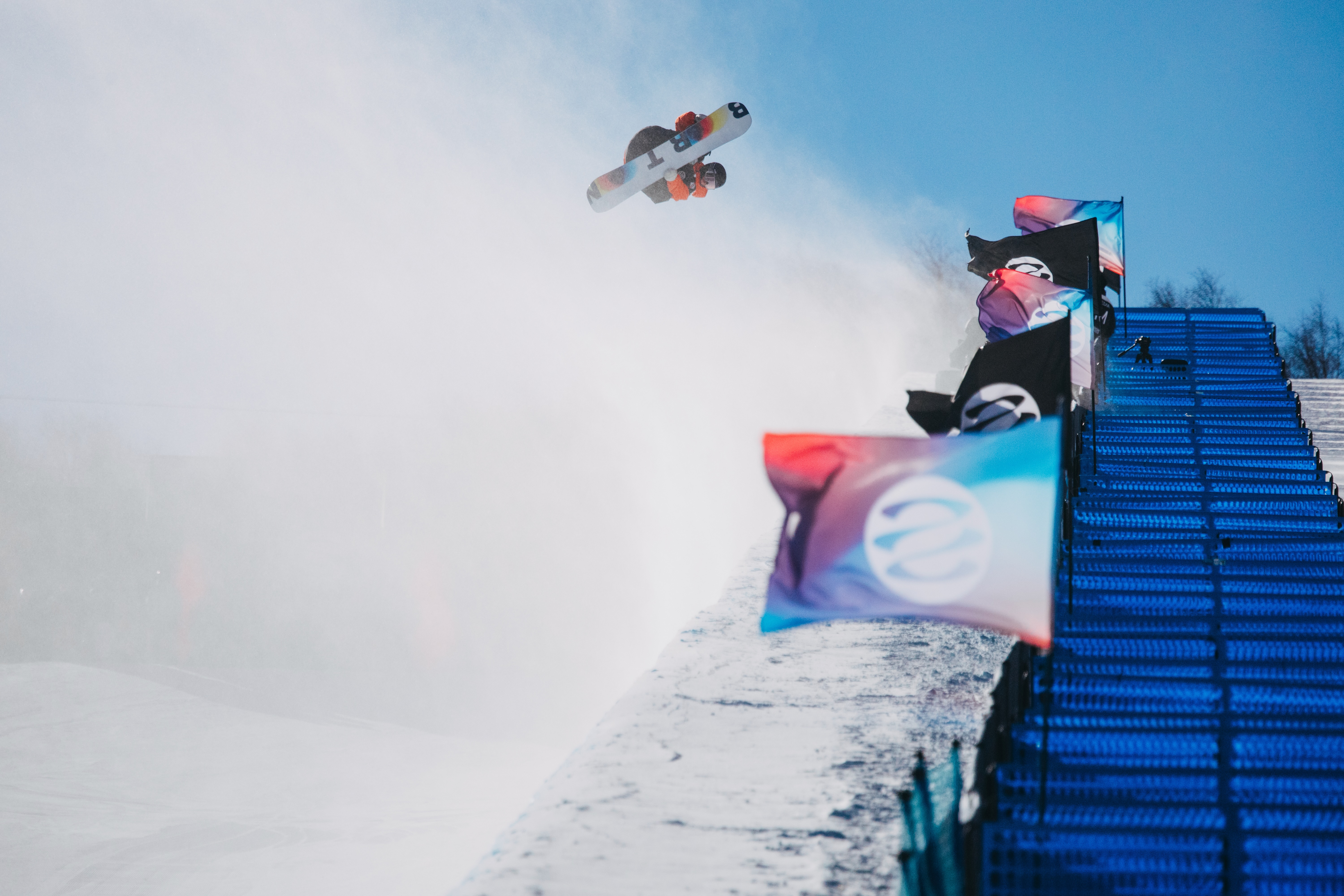 Jonas Hasler performing a freestyle snowboard trick